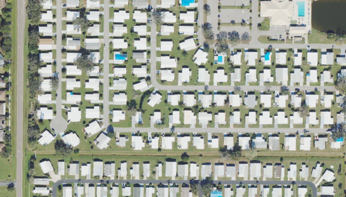 Aerial photograph of the clubhouse and amenities at Camelot Lakes Village