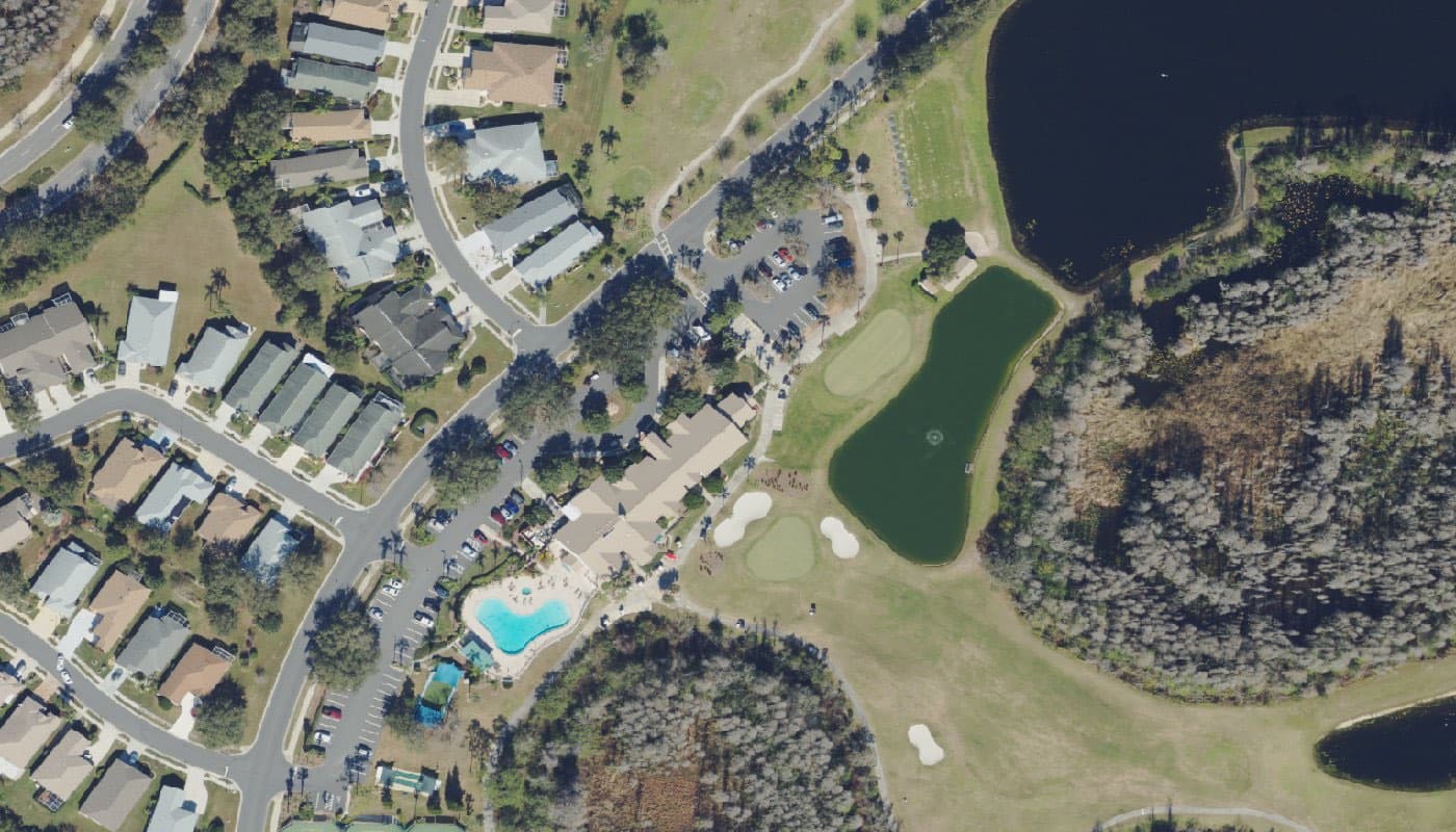 Aerial photograph of the clubhouse and amenities at The Groves Golf and Country Club